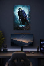 The Dark Knight Joker in a gaming desk setup above a monitor.