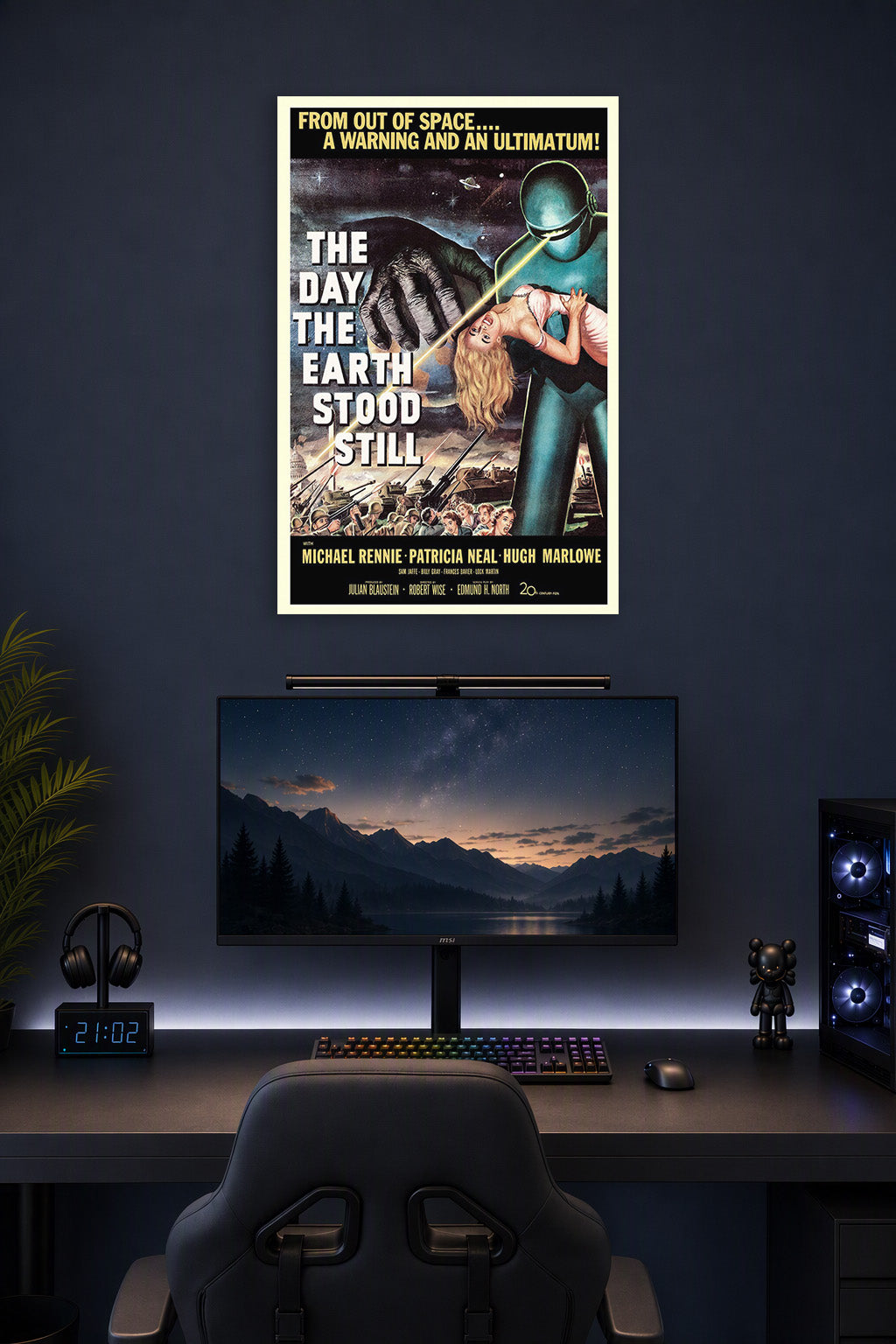 The Day the Earth Stood Still Movie Poster in a gaming desk setup above a monitor.