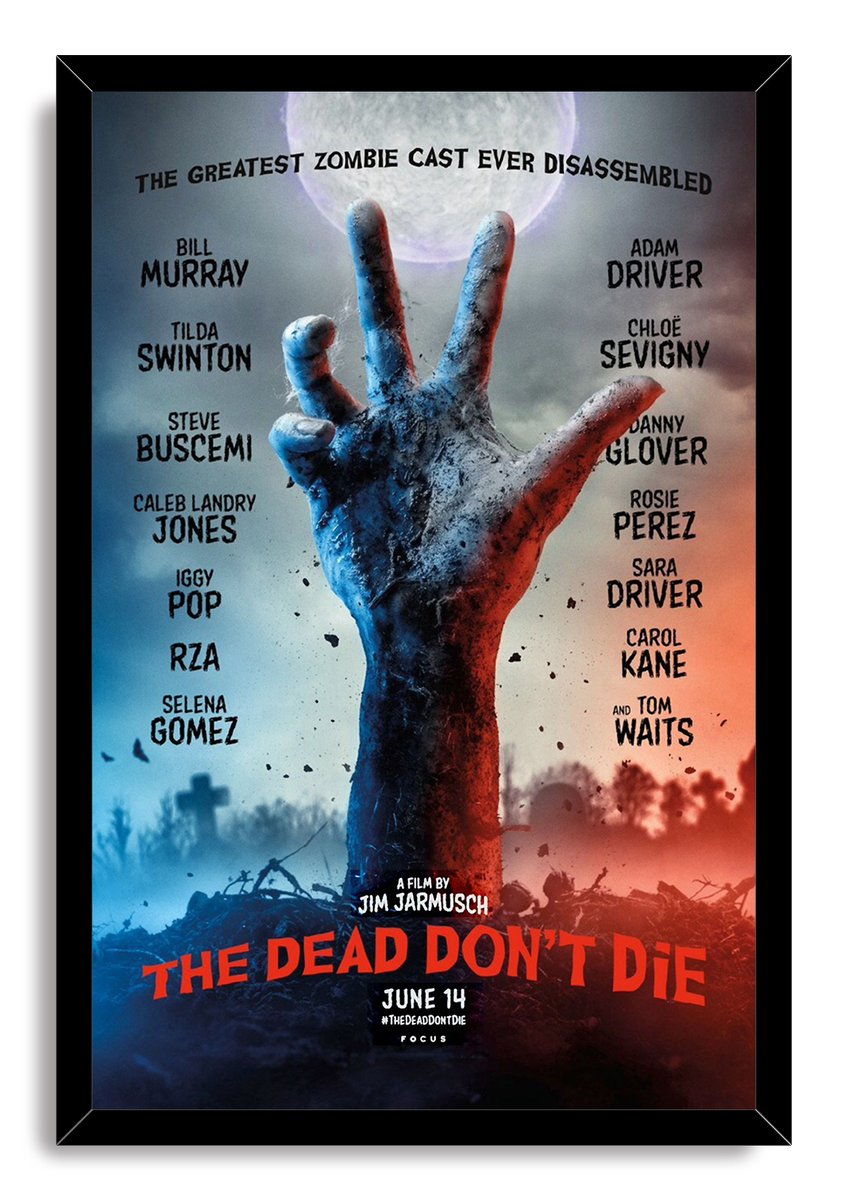 The Dead Don't Die framed wall art print features a raised zombie hand beneath a full moon in a blue and red graveyard.