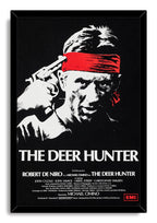 The Deer Hunter framed wall art print displays Robert De Niro with a gun at his temple, red headband, title, and cast credits.