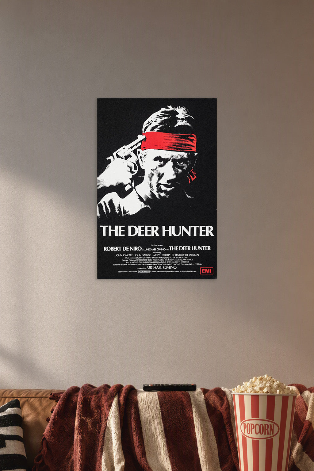The Deer Hunter Movie Robert De Niro in a cozy movie room above a brown sofa with popcorn.