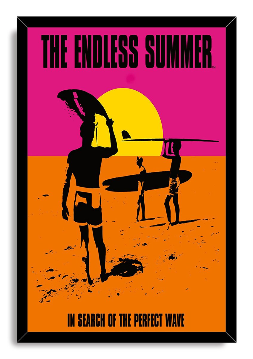 The Endless Summer framed wall art print features black surfer silhouettes, a yellow sun, pink sky, and orange beach.