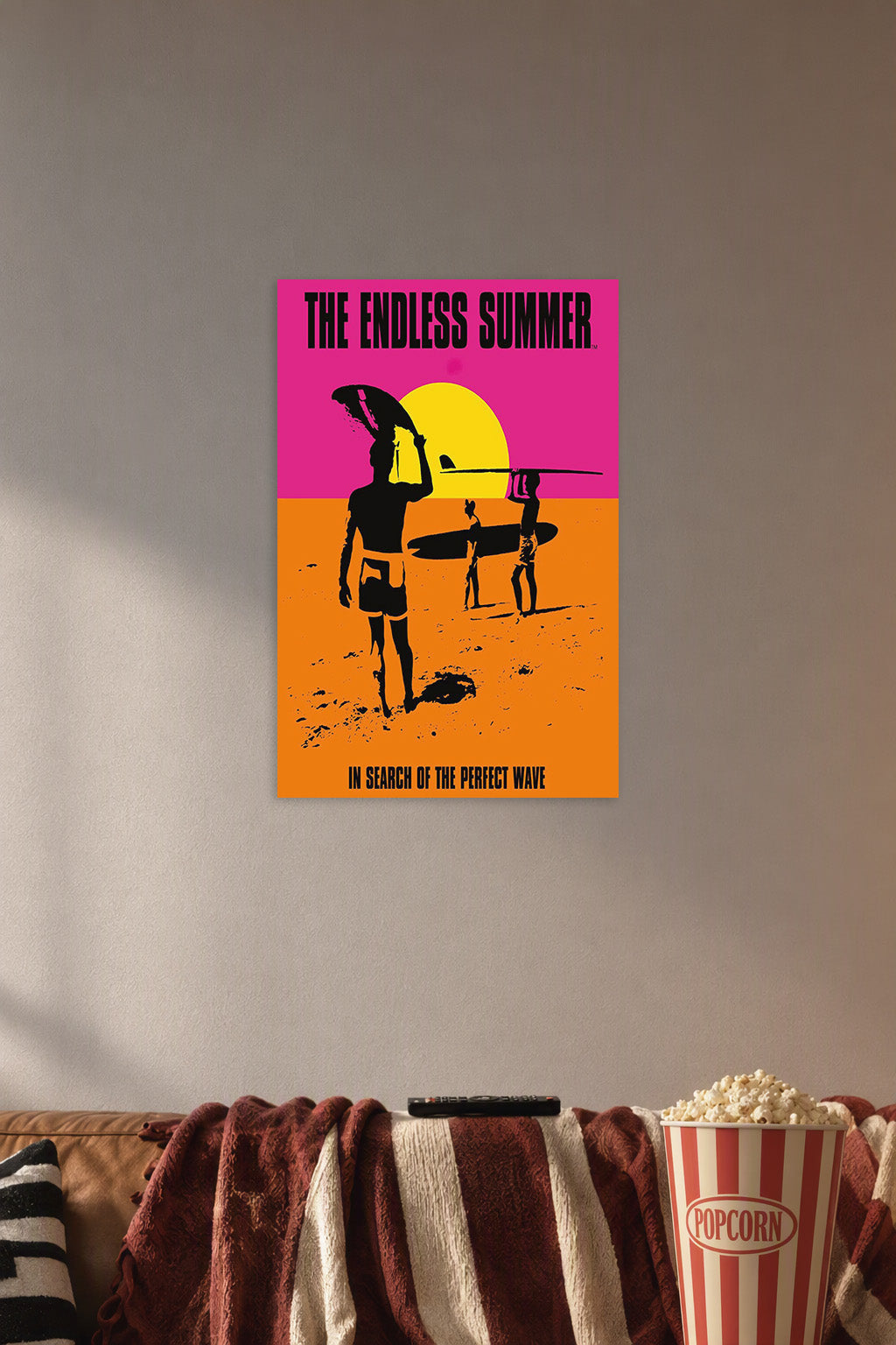 The Endless Summer Movie in a cozy movie room above a brown sofa with popcorn.