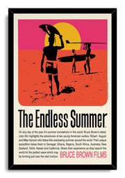 The Endless Summer framed wall art print features surfers and longboards in black silhouettes against an orange, pink, and yellow beach scene.