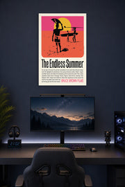 The Endless Summer Movie Poster in a gaming desk setup above a monitor.