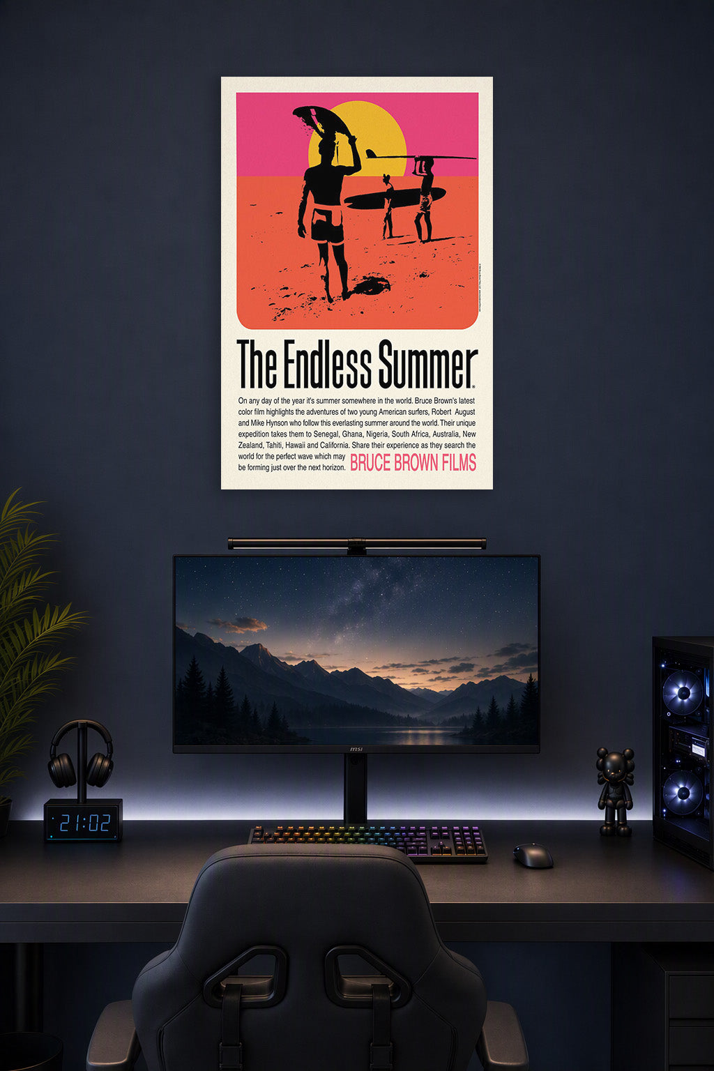The Endless Summer Movie Poster in a gaming desk setup above a monitor.