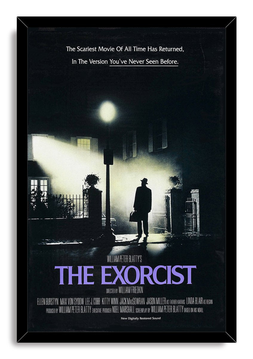 The Exorcist framed wall art print depicts a lone man with a case outside a shadowy home lit by mist and a streetlamp.