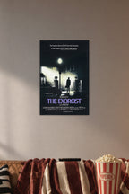 The Exorcist in a cozy movie room above a brown sofa with popcorn.
