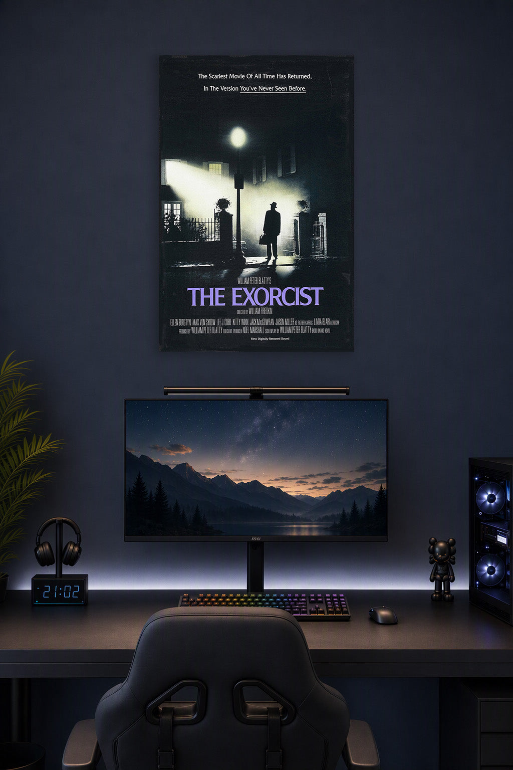 The Exorcist in a gaming desk setup above a monitor.