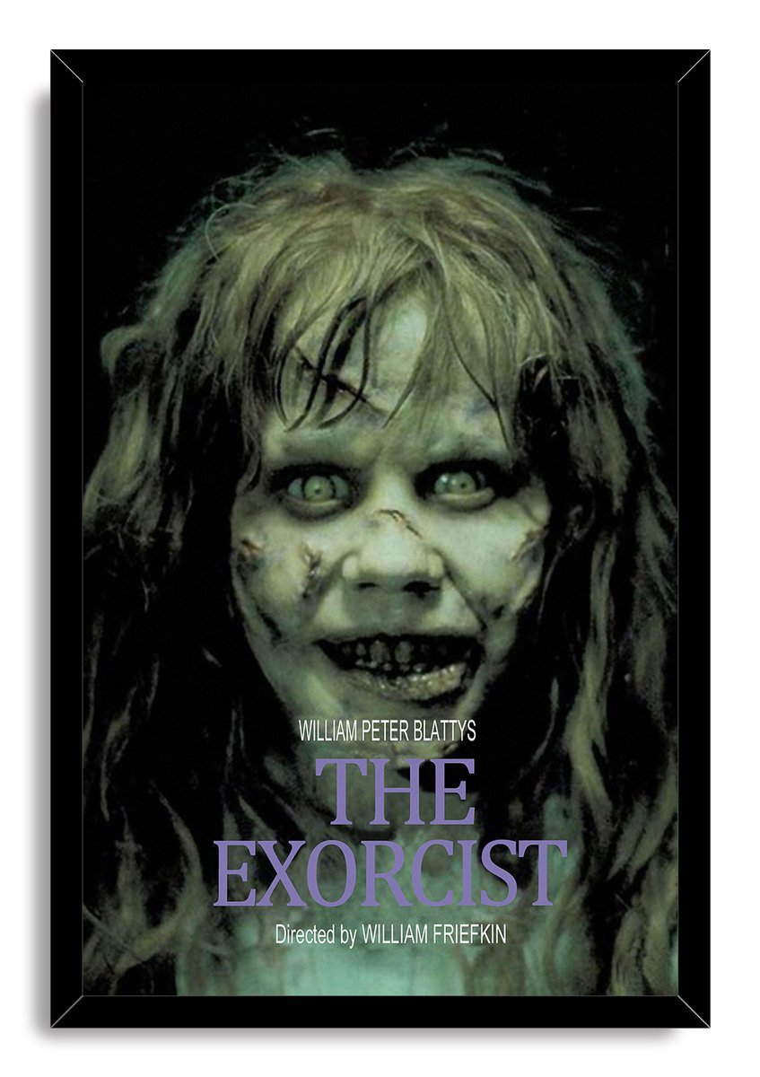 The Exorcist framed wall art print features Regan MacNeil's eerie pale face, wild hair, black surround, and purple title text.