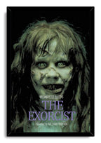 The Exorcist framed wall art print features Regan MacNeil's eerie pale face, wild hair, black surround, and purple title text.