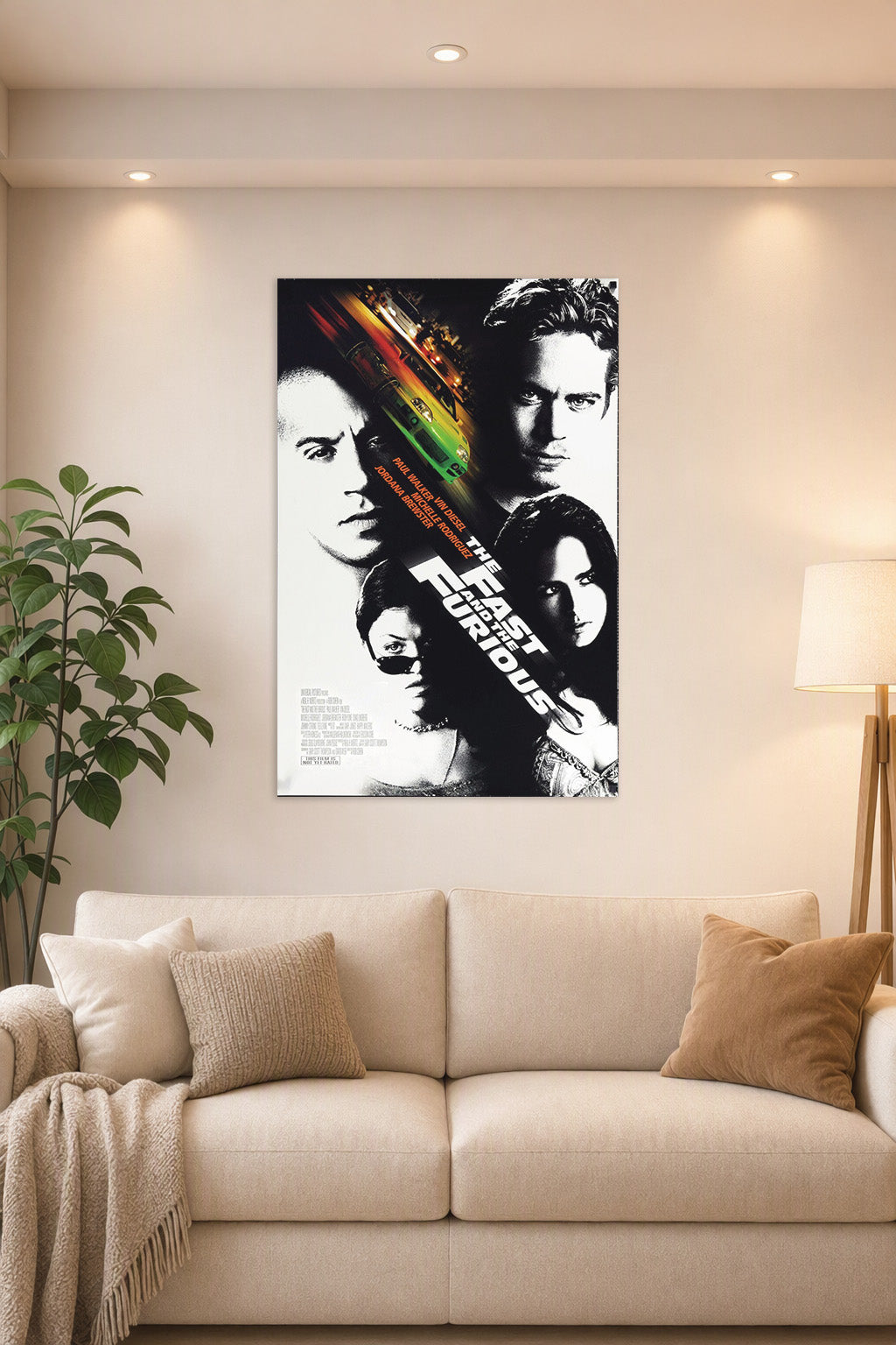 The Fast and the Furious Movie Cast in a bright living room above a beige sofa.