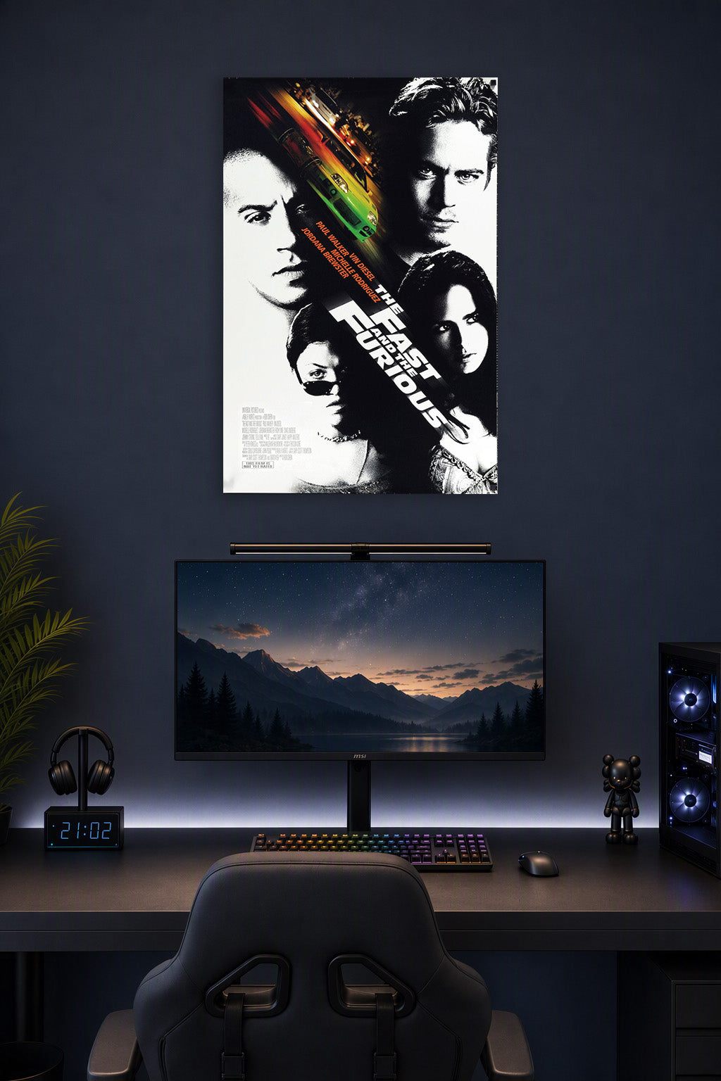The Fast and the Furious Movie Cast in a gaming desk setup above a monitor.