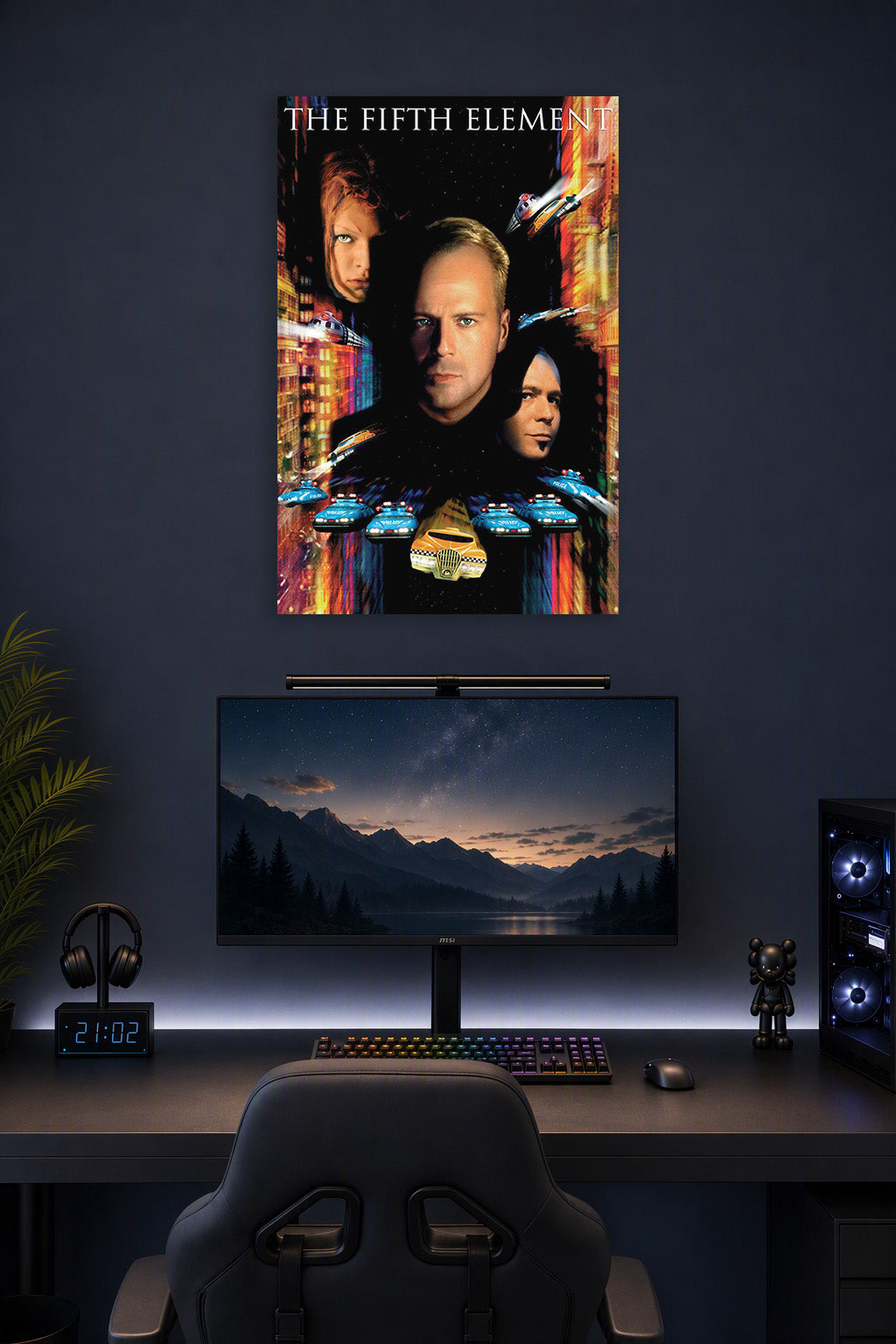 The Fifth Element Movie in a gaming desk setup above a monitor.