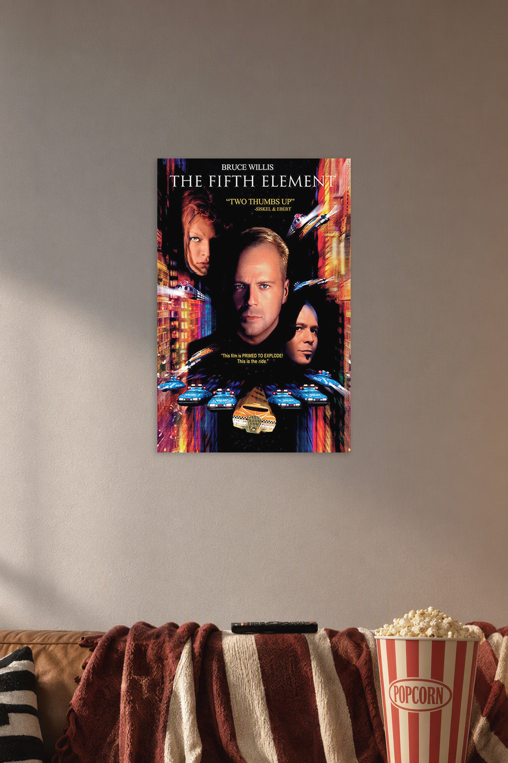 The Fifth Element Movies in a cozy movie room above a brown sofa with popcorn.