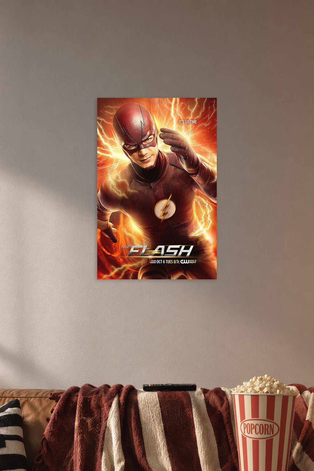 The Flash in a cozy movie room above a brown sofa with popcorn.