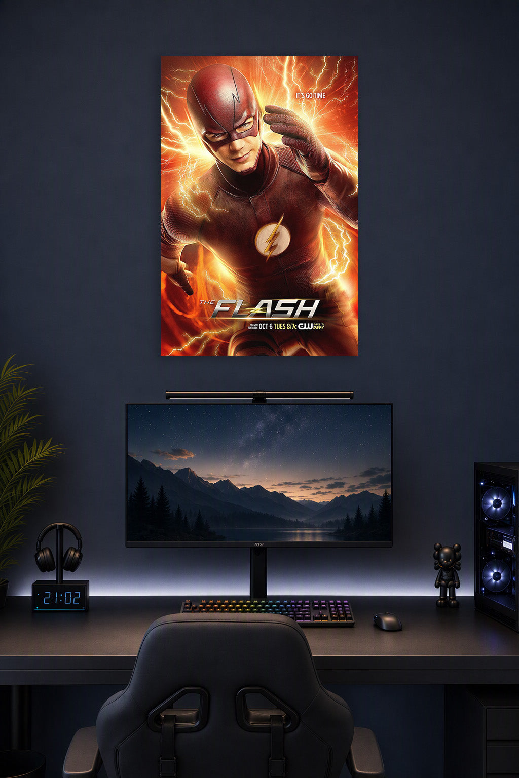 The Flash in a gaming desk setup above a monitor.