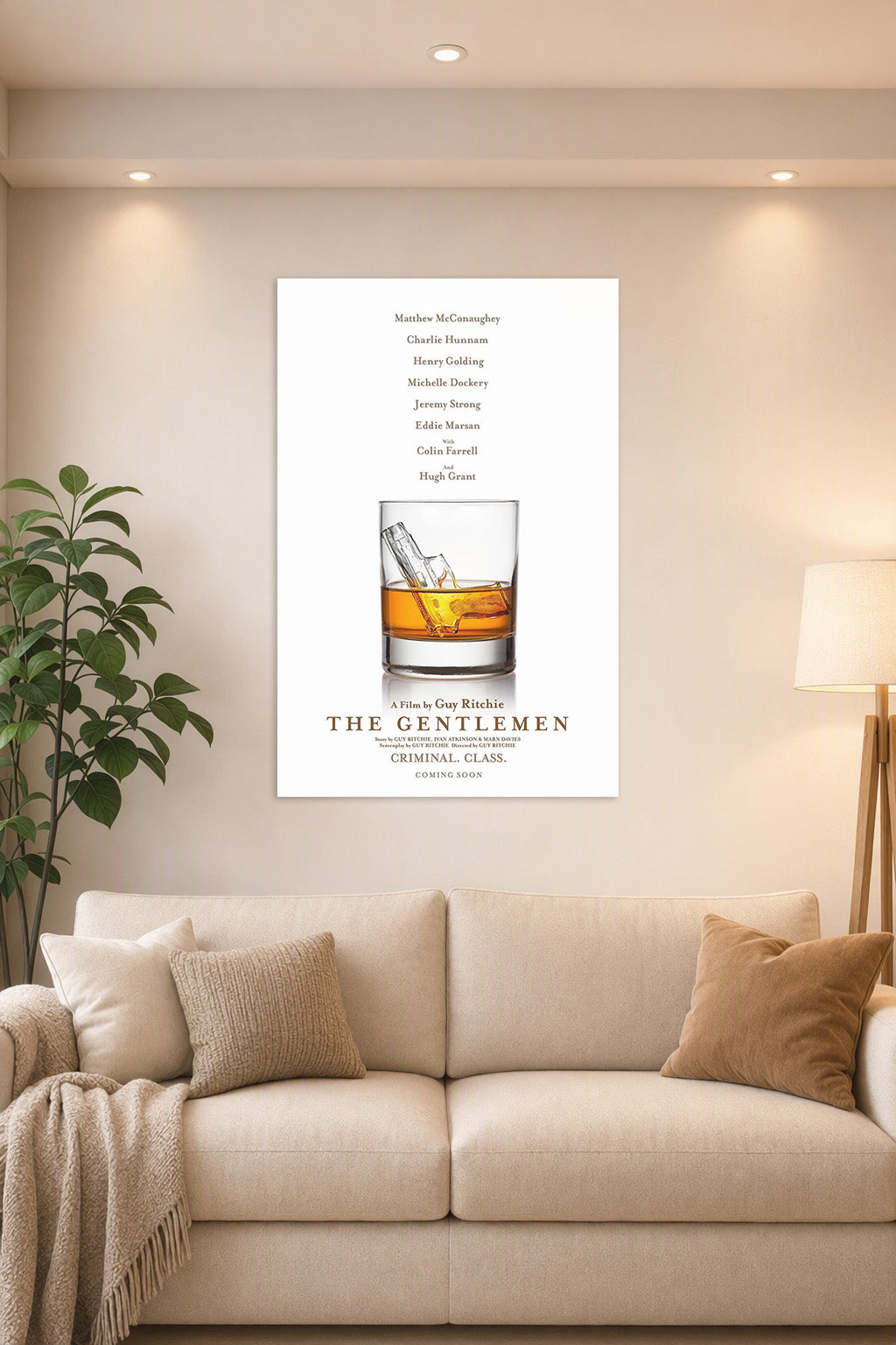 The Gentlemen Movie Poster in a bright living room above a beige sofa.