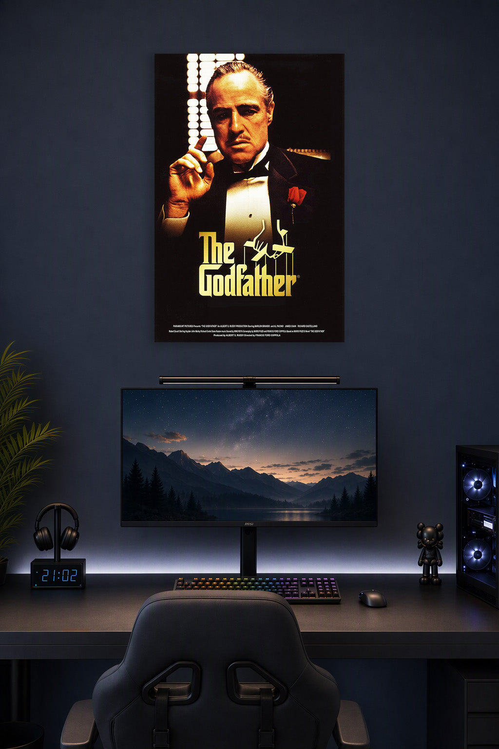 The Godfather in a gaming desk setup above a monitor.