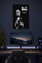 The Godfather in a gaming desk setup above a monitor.