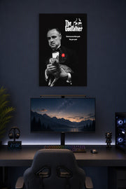 The Godfather in a gaming desk setup above a monitor.