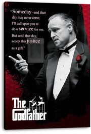 The Godfather canvas wall art print displays Don Vito Corleone pointing in a tuxedo beside a quote and red patterned accents.