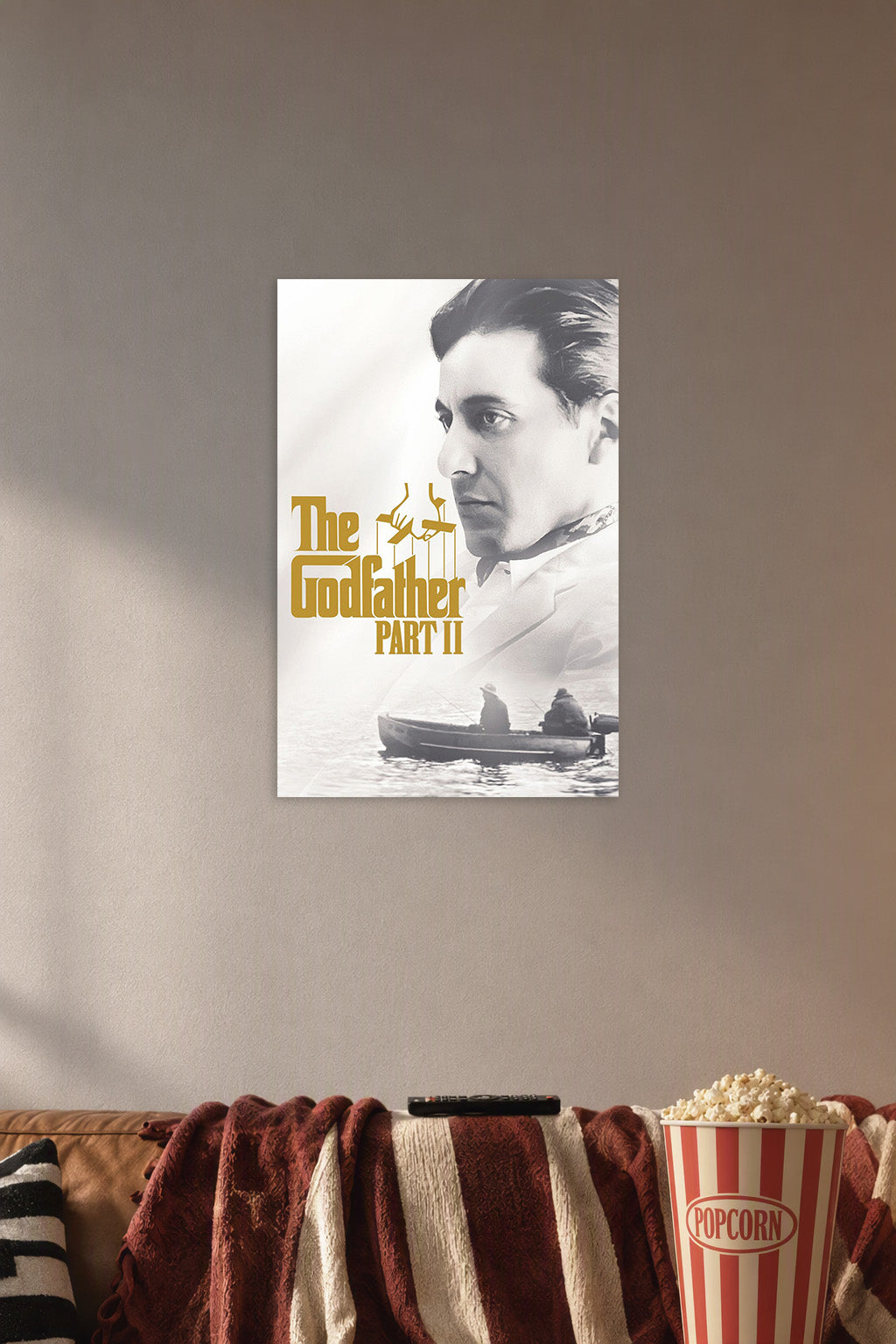 The Godfather Part II in a cozy movie room above a brown sofa with popcorn.