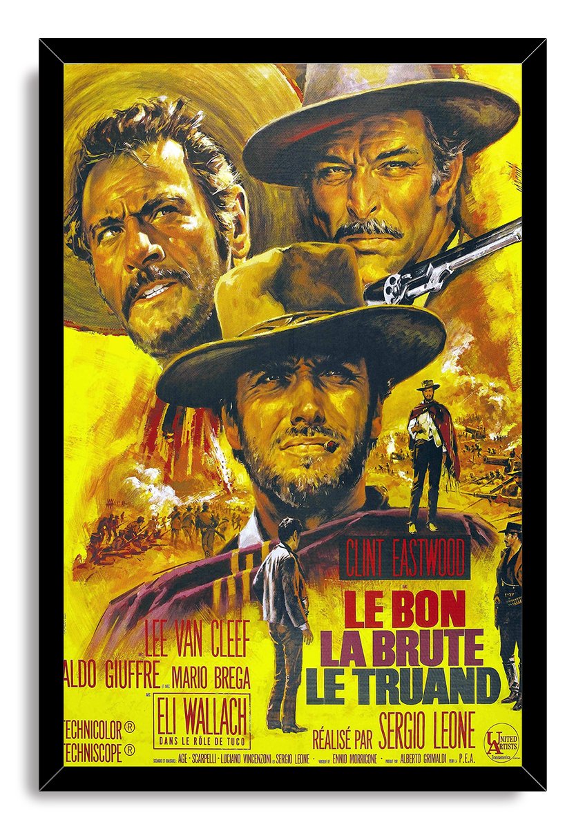 The Good, the Bad and the Ugly framed wall art print pairs a black frame with Western portraits, armed figures, desert scenes, and bold French poster lettering.