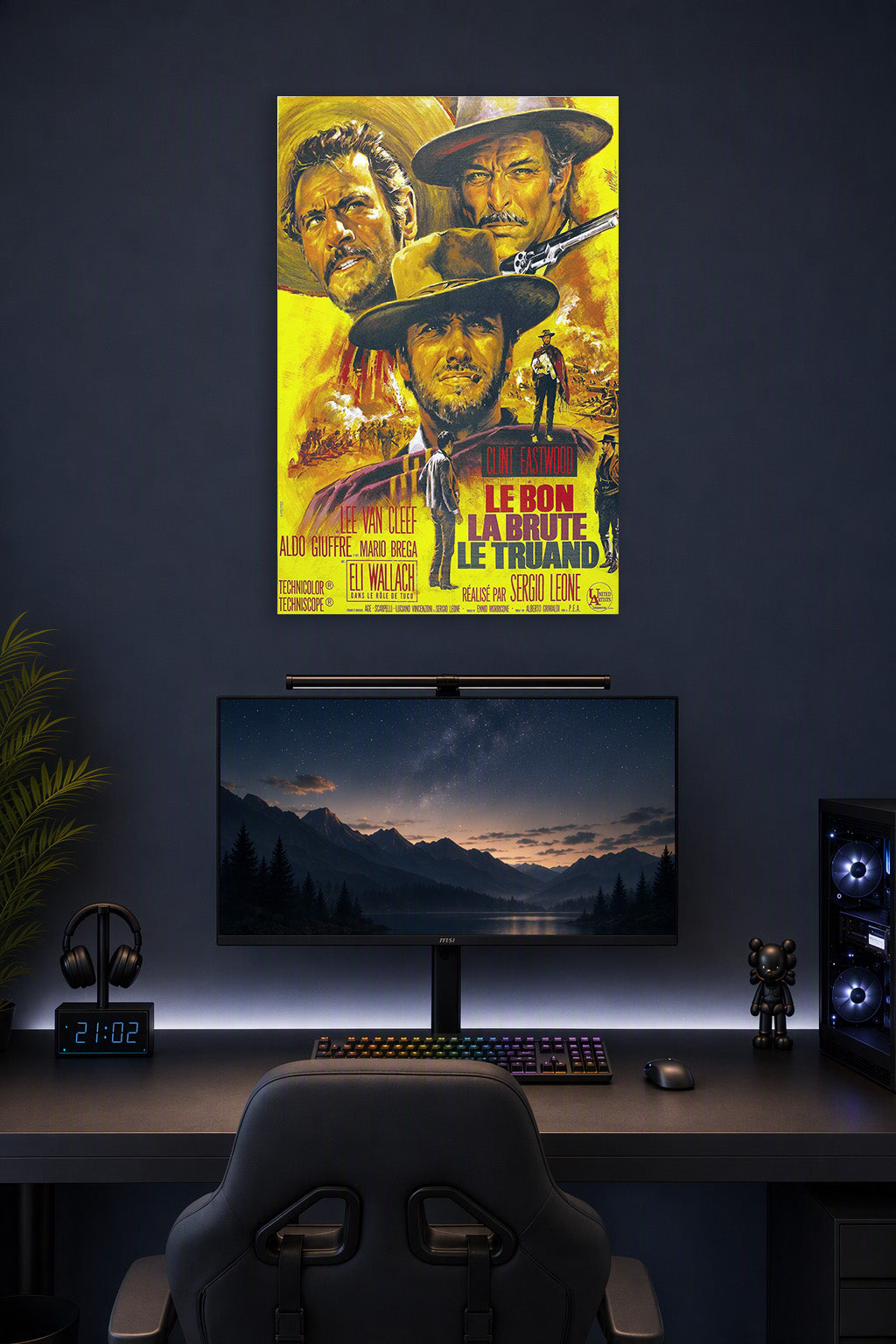 The Good The Bad The Ugly Movie Poster in a gaming desk setup above a monitor.