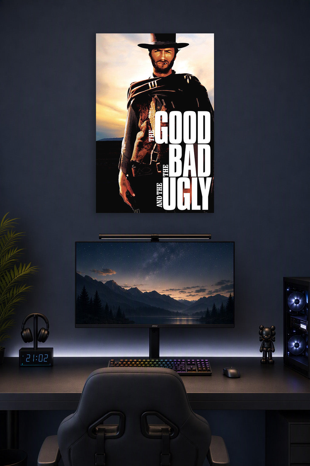 The Good The Bad and The Ugly Clint Eastwood in a gaming desk setup above a monitor.