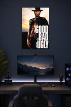 The Good The Bad and The Ugly Clint Eastwood in a gaming desk setup above a monitor.
