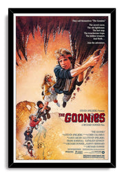 The Goonies framed wall art print features children suspended from a cave ceiling above an antique map in a black frame.