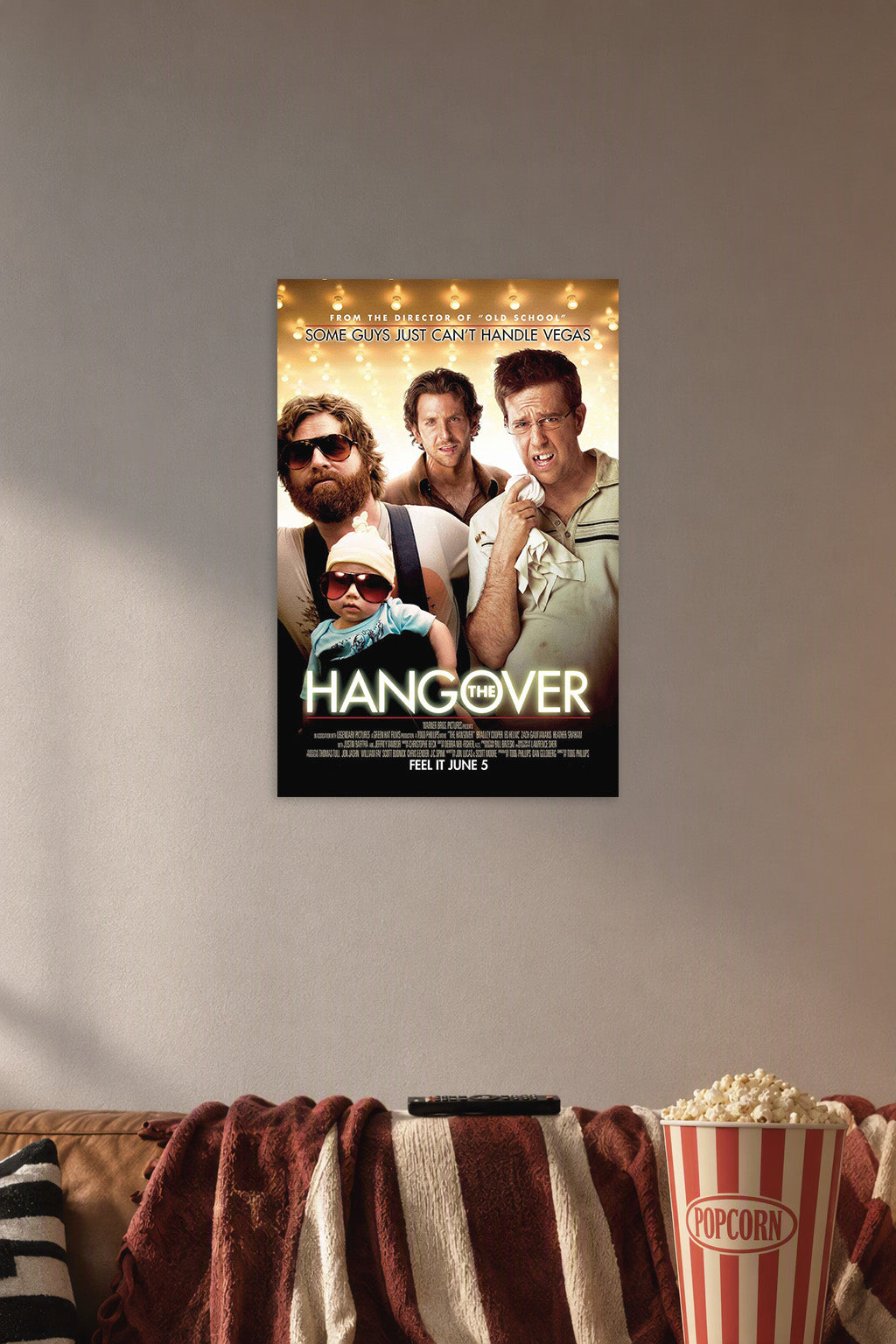 The Hangover Movie Characters in a cozy movie room above a brown sofa with popcorn.