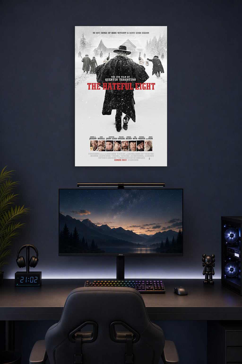 The Hateful Eight in a gaming desk setup above a monitor.