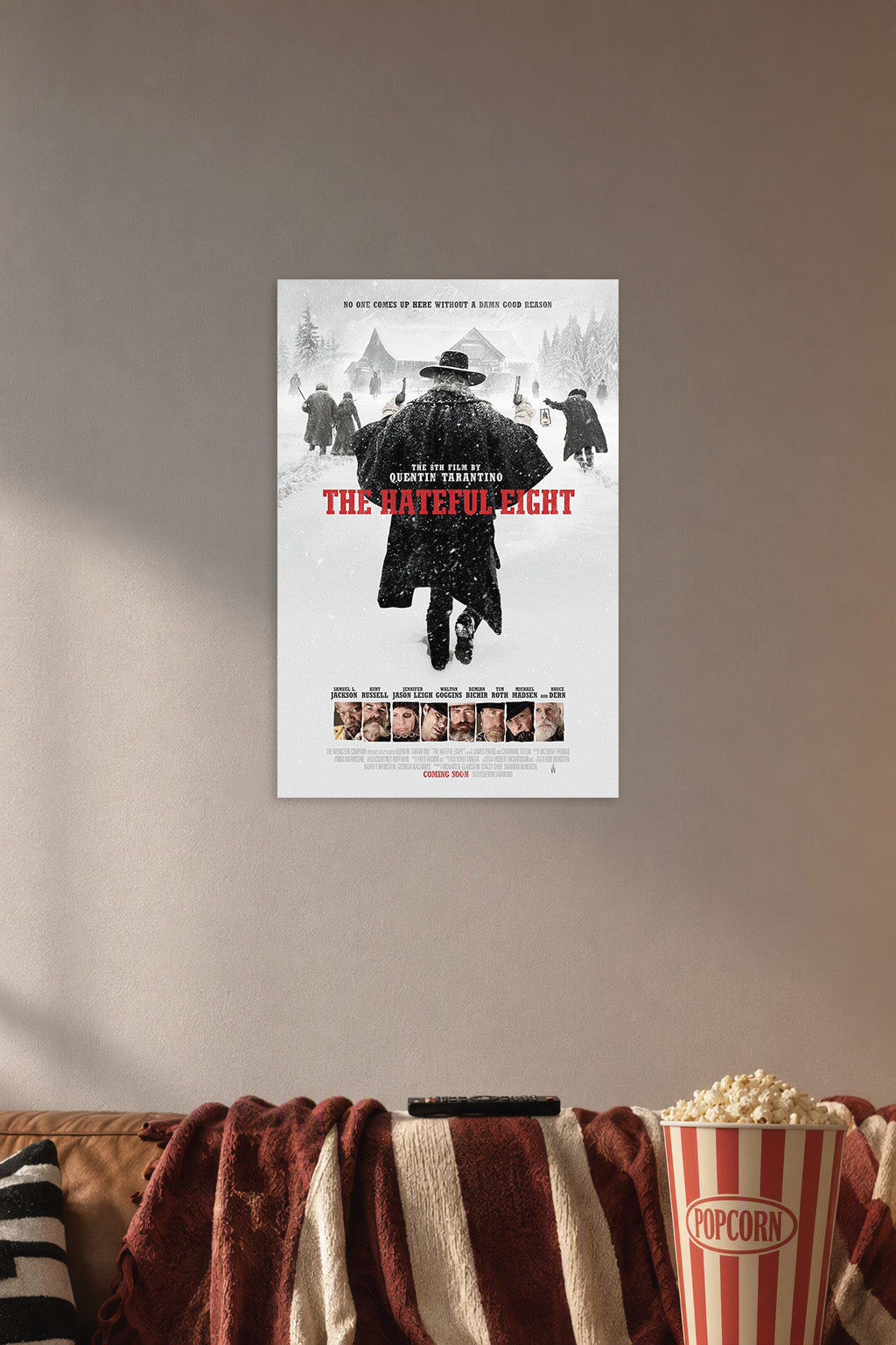 The Hateful Eight Movie in a cozy movie room above a brown sofa with popcorn.