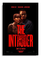 The Intruder framed wall art print with Michael Ealy and Meagan Good portraits, vivid red lettering, and black border.
