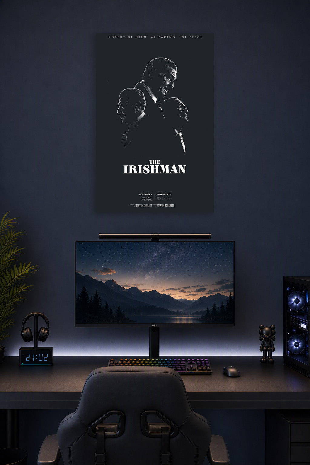 The Irishman Robert De Niro Al Pacino Joe Pesci Movie Poster in a gaming desk setup above a monitor.