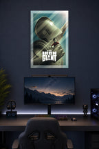 The Iron Giant Movie Poster in a gaming desk setup above a monitor.