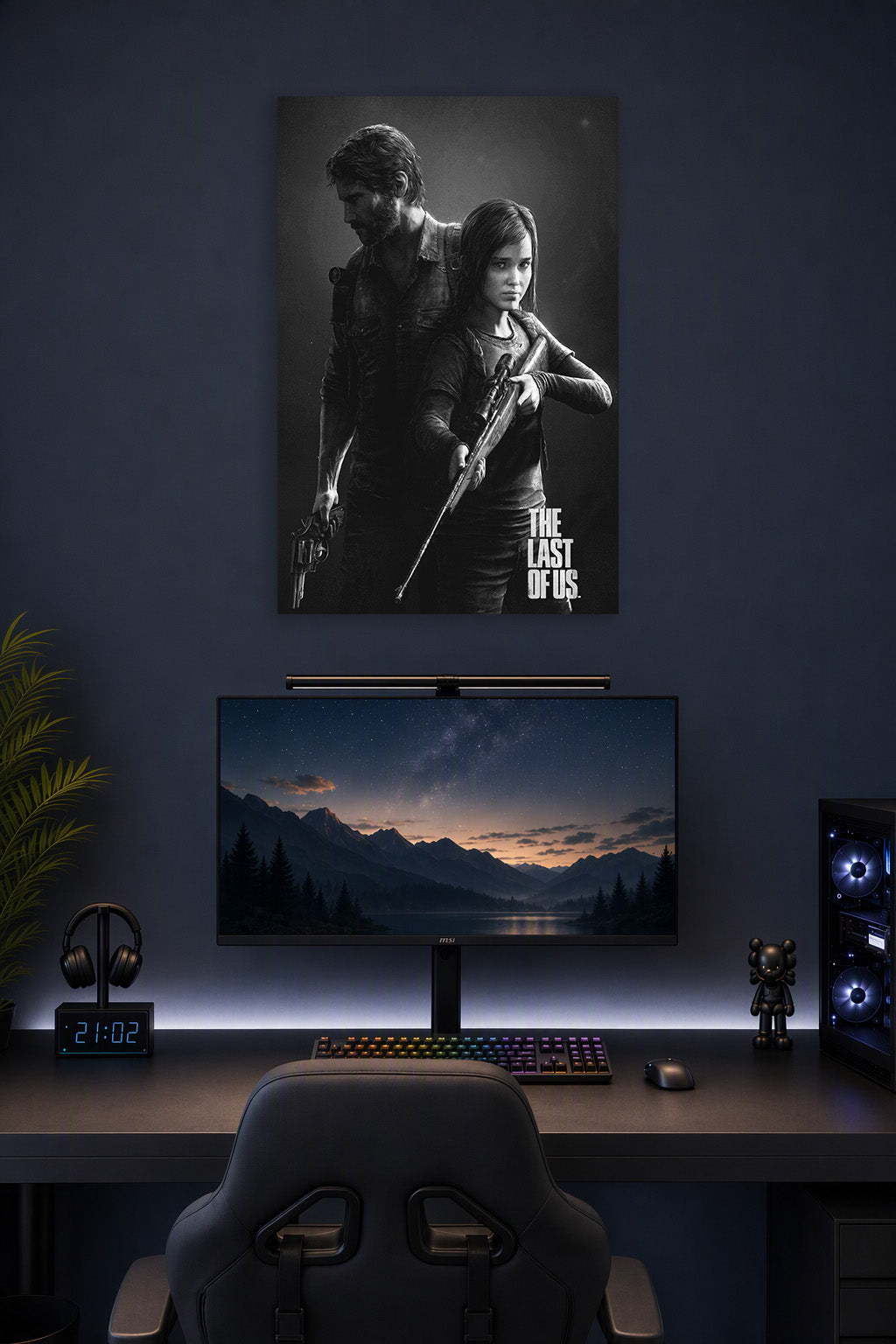 The Last of Us Joel and Ellie in a gaming desk setup above a monitor.
