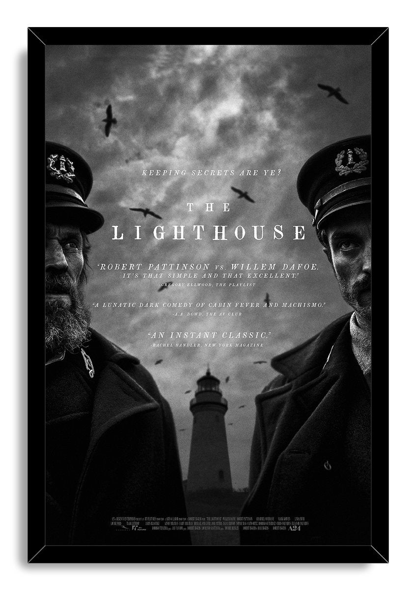 The Lighthouse framed wall art print displays a monochrome film poster of two lighthouse keepers, birds, cloudy sky, and central tower.