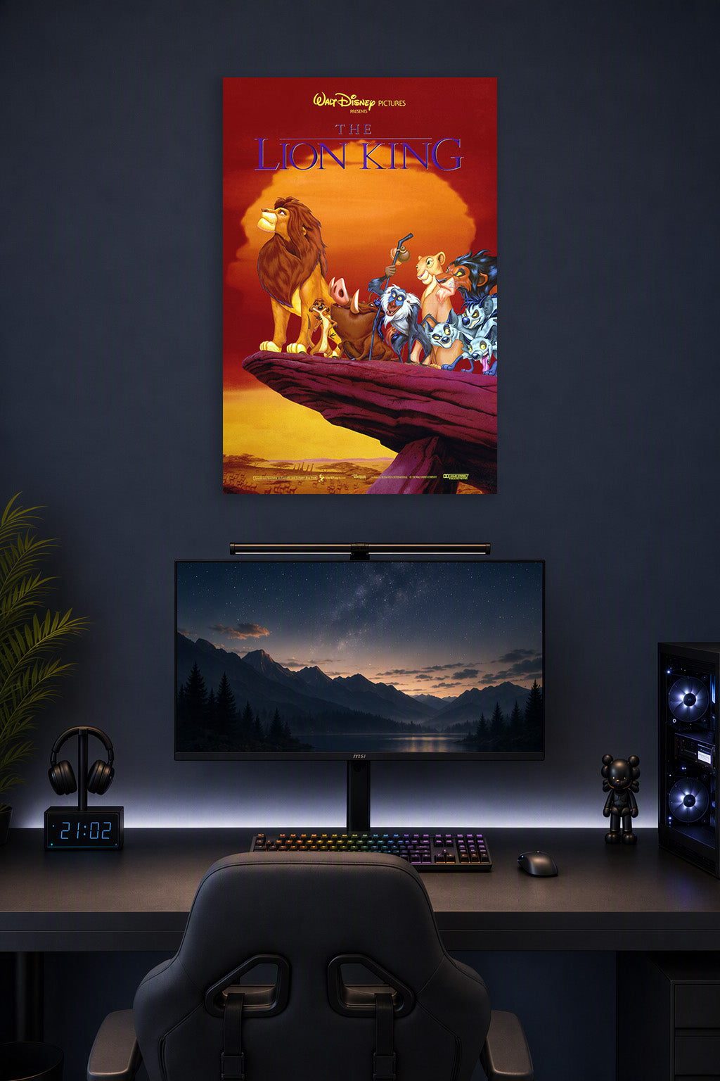 The Lion King in a gaming desk setup above a monitor.