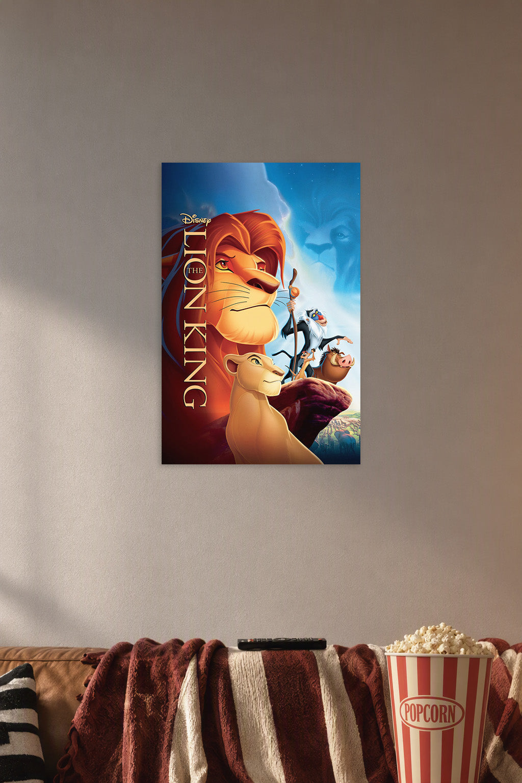 The Lion King in a cozy movie room above a brown sofa with popcorn.