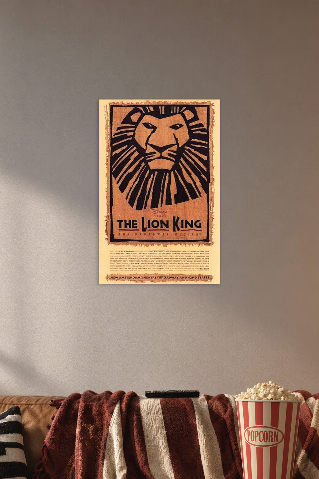 The Lion King The Broadway Musical Poster Broadway Theater Play in a cozy movie room above a brown sofa with popcorn.