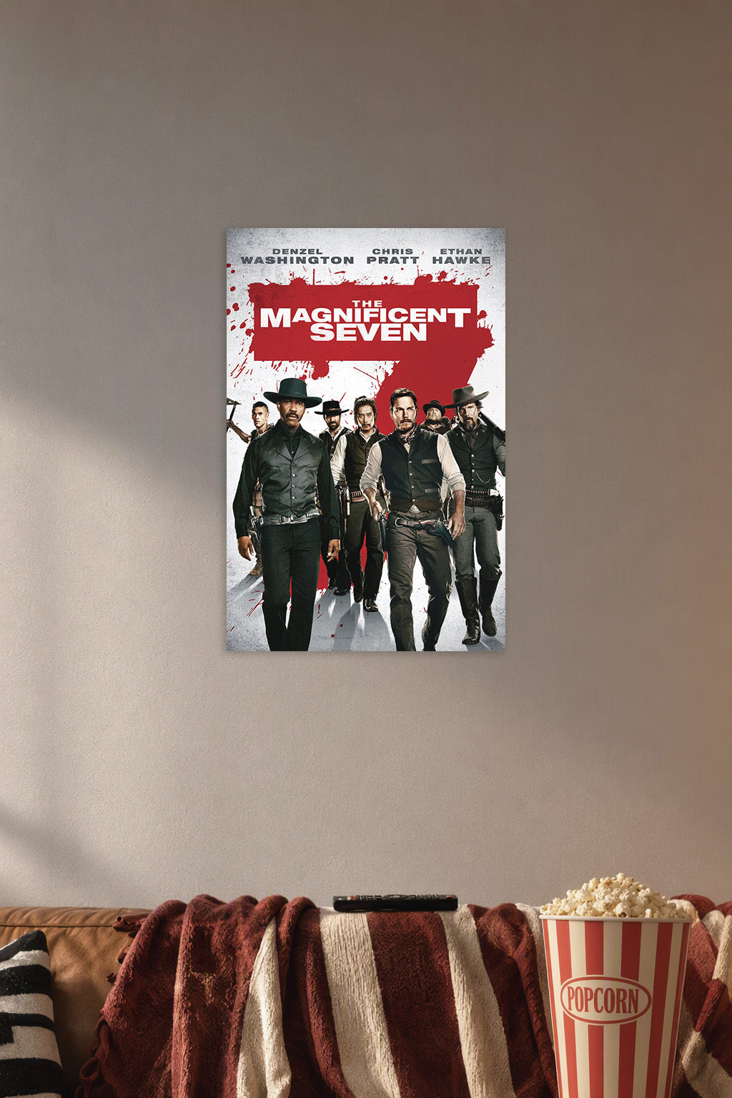 The Magnificent Seven Movie Poster in a cozy movie room above a brown sofa with popcorn.