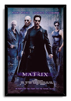 The Matrix framed wall art print with Neo holding a rifle, flanked by Morpheus, Trinity, and another armed figure.
