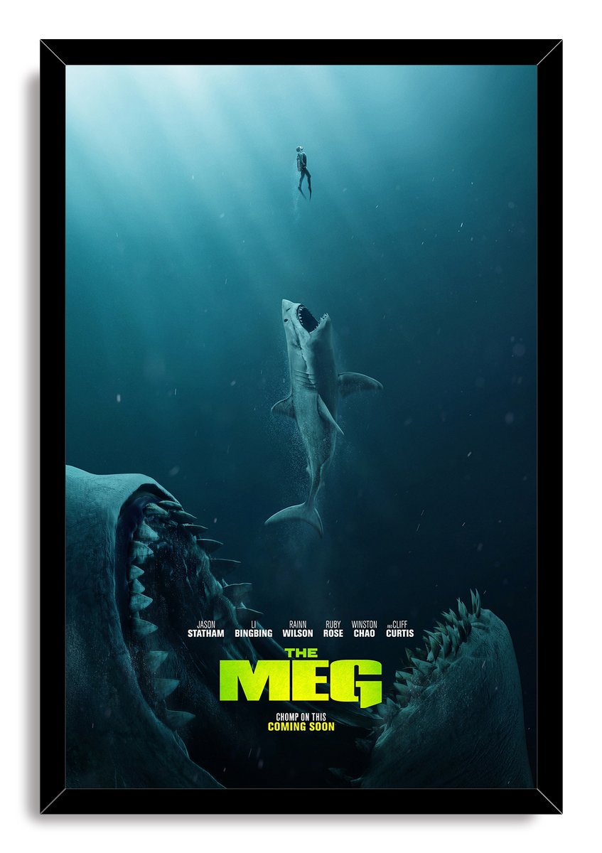 The Meg framed wall art print presents a deep blue underwater scene of a diver, shark, and enormous Megalodon jaws.