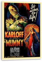 The Mummy wall art print on a thick white canvas shows a wrapped green figure, red-dressed woman, and bold vintage lettering.