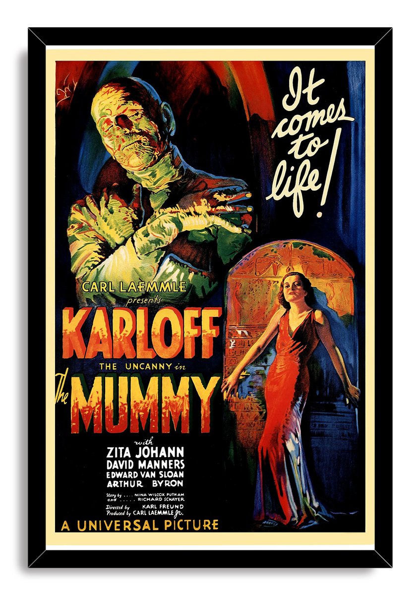 The Mummy framed wall art print in a black frame depicts a bandaged figure, Egyptian archway, and woman in a red dress.