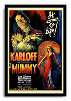 The Mummy framed wall art print in a black frame depicts a bandaged figure, Egyptian archway, and woman in a red dress.