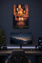 The Mummy Returns Movie Poster in a gaming desk setup above a monitor.